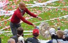 As Bayern head coach Pep Guardiola tries  to pose for the photographers as the trophy falls down  after Bayern Munich won the Bundesliga Championships   in the Allianz Arena in Munich, Germany, on Saturday, May 10. 2014. (AP Photo/Kerstin Joensson)  ORG XMIT: XKJ126