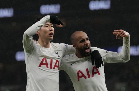 Tottenham's Son Heung-min, left, celebrates his goal against Southampton with his teammate Lucas Moura during the English Premier League soccer match between Tottenham Hotspur and Southampton at the Tottenham Hotspur Stadium in London, Wednesday, Feb. 9, 2022. (AP Photo/Alastair Grant)