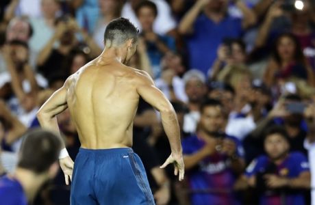 Real Madrid's Cristiano Ronaldo, back to camera, celebrates after scoring during the Spanish Supercup, first leg, soccer match against FC Barcelona at Camp Nou stadium in Barcelona, Spain, Sunday, Aug. 13, 2017. (AP Photo/Manu Fernandez)