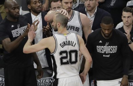 San Antonio Spurs guard Manu Ginobili (20) is greeted by teammate as he walks off the court after for the final time in Game 4 of the NBA basketball Western Conference finals against the Golden State Warriors, Monday, May 22, 2017, in San Antonio. Golden State won 129-115. (AP Photo/Eric Gay)