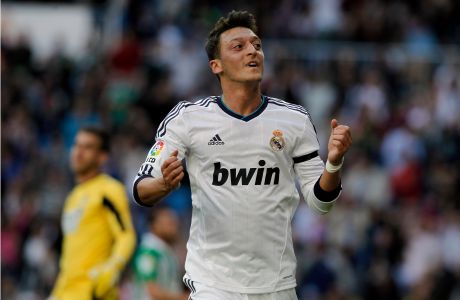 Real Madrid's Mesut Ozil from Germany celebrates his goal during a Spanish La Liga soccer match against Betis at the Santiago Bernabeu stadium in Madrid, Spain, Saturday, April 20, 2013. (AP Photo/Andres Kudacki)