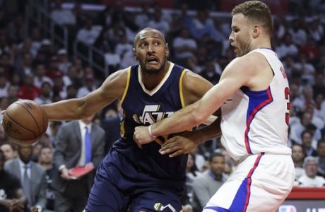 Utah Jazz's Boris Diaw, left, drives against Los Angeles Clippers' Blake Griffin during the first half in Game 2 of an NBA basketball first-round playoff series Tuesday, April 18, 2017, in Los Angeles. (AP Photo/Jae C. Hong)