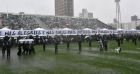 Soldiers carry into the stadium under heavy rain the coffins of the members of the Chapecoense Real football club team killed in a plane crash in Colombia, in  Chapeco, Santa Catarina, southern Brazil, on December 3, 2016. The banner reads "In the moments of joy as in the darkest hours, my hurricane, you'll be always the vanquisher"
The bodies of 50 players, coaches and staff from a Brazilian football team tragically wiped out in a plane crash in Colombia arrived home Saturday for a massive funeral. / AFP PHOTO / Nelson Almeida