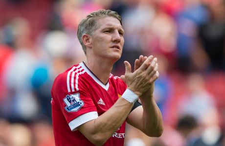 FILE - In this Saturday, Aug. 8, 2015 file photo, Manchester United's Bastian Schweinsteiger applauds supporters after his team's English Premier League soccer match between Manchester United and Tottenham Hotspur at Old Trafford Stadium, Manchester, England. World Cup winner Bastian Schweinsteiger is leaving Manchester United to join Chicago Fire, it was announced Tuesday March 21, 2017. (AP Photo/Jon Super, File)