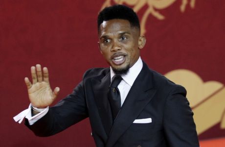 Former soccer player of Cameroon Samuel Eto'o arrives for the 2018 soccer World Cup draw in the Kremlin in Moscow, Friday, Dec. 1, 2017. (AP Photo/Dmitri Lovetsky)