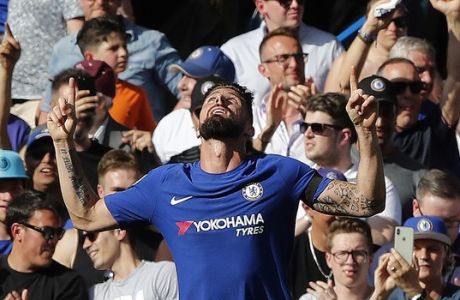 Chelsea's Olivier Giroud celebrates after scoring his sides opening goal during the English Premier League soccer match between Chelsea and Liverpool at Stamford Bridge stadium in London, Sunday, May 6, 2018. (AP Photo/Frank Augstein)