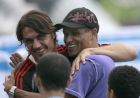 AC Milan soccer team player Paolo Maldini,  left, embraces former Brazilian soccer  international Rivaldo before a training session at the Olympic Stadium in Athens, Tuesday May 22, 2007. Liverpool will face Italian team AC Milan in the final of the Champions League in Athens on Wednesday.  (AP Photo/Luca Bruno)