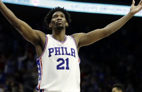 FILE - In this Jan. 27, 2017, file photo, Philadelphia 76ers' Joel Embiid reacts during an NBA basketball game against the Houston Rockets in Philadelphia. Embiid's numbers are the best in the rookie class. Yet his rookie of the year chances seem very flawed for this reason: Embiid will miss nearly two-thirds of Philadelphia's season because of injuries. (AP Photo/Matt Slocum, File)