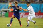 NATAL, BRAZIL - JUNE 19: Yoshito Okubo of Japan controls the ball against Sokratis Papastathopoulos of Greece during the 2014 FIFA World Cup Brazil Group C match between Japan and Greece at Estadio das Dunas on June 19, 2014 in Natal, Brazil.  (Photo by Mark Kolbe/Getty Images)