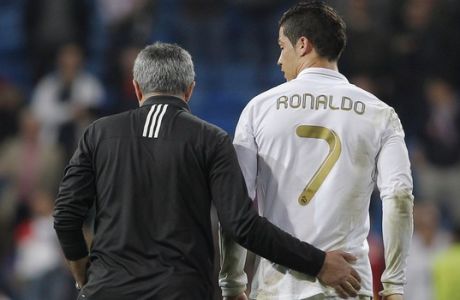 Real Madrid's coach Jose Mourinho from Portugal embraces Cristiano Ronaldo from Portugal after a Champions League round of 16, second leg soccer match against CSKA Moscow's at the Santiago Bernabeu Stadium, in Madrid, Wednesday, March 14, 2012. (AP Photo/Daniel Ochoa de Olza)