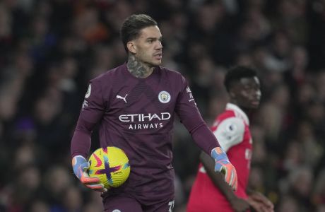 Manchester City's goalkeeper Ederson reacts during the English Premier League soccer match between Arsenal and Manchester City at the Emirates stadium in London, England, Wednesday, Feb.15, 2023. (AP Photo/Kin Cheung)