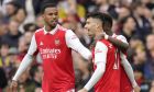 Arsenal's Gabriel Martinelli, centre, celebrates with Arsenal's Gabriel, left, and Arsenal's Bukayo Saka, right, after scoring his side's opening goal during the English Premier League soccer match between Arsenal and Crystal Palace at Emirates stadium in London, Sunday, March 19, 2023. (AP Photo/Kirsty Wigglesworth)