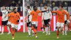 Netherland's Quincy Promes, center, celebrates after scoring his side's first goal during the UEFA Nations League soccer match between Germany and The Netherlands in Gelsenkirchen, Monday, Nov. 19, 2018. (AP Photo/Martin Meissner)
