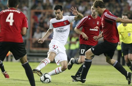 PSG's newly signed midfielder, Argentinian Javier Matias Pastore, center, challenges for the ball with Differdange's Michel Kettenmeyer, right, and Andre Rodrigues, left, during the Europa League qualifying first leg soccer match, Differdange 03 against Paris Saint Germain at Josy Barthel stadium in Differdange, Luxembourg, Thursday, Aug. 18, 2011. (AP Photo/Mathieu Cugnot)