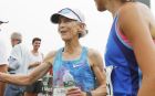 Former Olympian Joan Benoit Samuelson greets finishers after running the 20th annual TD Beach To Beacon 10K road race Saturday, Aug. 5, 2017 in Cape Elizabeth, Maine. (AP Photo/Joel Page)