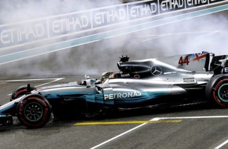 Mercedes driver Lewis Hamilton of Britain spins his car after the Emirates Formula One Grand Prix at the Yas Marina racetrack in Abu Dhabi, United Arab Emirates, Sunday, Nov. 26, 2017. (AP Photo/Luca Bruno)