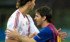 AC Milan forward Zlatan Ibrahimovic, of Sweden, left, hugs with Barcelona forward Lionel Messi, of Argentina, during a Champions League first leg quarterfinals soccer match, between AC Milan and Barcelona, at the San Siro stadium, in Milan, Italy, Wednesday, March, 28, 2012. (AP Photo/Luca Bruno)