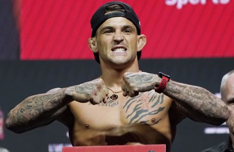 Dustin Poirier poses during a ceremonial weigh-in for a UFC 264 mixed martial arts bout Friday, July 9, 2021, in Las Vegas. Poirier is scheduled to fight Conor McGregor in a lightweight bout Saturday in Las Vegas (AP Photo/John Locher)