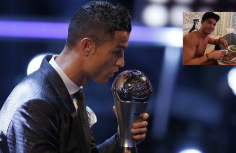Portuguese soccer player Christiano Ronaldo holds the Best FIFA Men's player award during The Best FIFA 2017 Awards at the Palladium Theatre in London, Monday, Oct. 23, 2017. (AP Photo/Alastair Grant)
