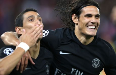 PSG's Angel Di Maria, left, and PSG's Edinson Cavani react after di Maria scored the opening goal during the Champions League Group A soccer match between PSG and Malmo at the Parc des Princes stadium in Paris, France, Tuesday, Sept. 15, 2015. (AP Photo/Francois Mori)