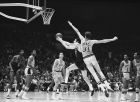 Boston's John Havlicek drives to the basket for two points against the Lakers in the final game of the NBA title playoff at Los Angeles  May 3, 1968. Mel Counts, 7 feet tall, tries to stop him. Lakers' Jerry West at left. Boston won, 124-109 to take the title, 4 games to 2. (AP Photo/HF)