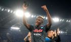Napoli's Victor Osimhen celebrates at the end of a Serie A soccer match between Roma and Napoli, at the Olimpic stadium in Rome, Sunday, Oct. 23, 2022. (AP Photo/Andrew Medichini)