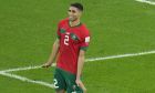 Morocco's Achraf Hakimi celebrates after he scored the decisive penalty at the end of the World Cup round of 16 soccer match between Morocco and Spain, at the Education City Stadium in Al Rayyan, Qatar, Tuesday, Dec. 6, 2022. (AP Photo/Ricardo Mazalan)