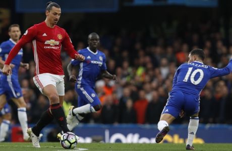 Manchester Uniteds Zlatan Ibrahimovic, left, and Chelseas Eden Hazard challenge for the ball during the English Premier League soccer match between Chelsea and Manchester United at Stamford Bridge stadium in London, Sunday, Oct. 23, 2016.(AP Photo/Kirsty Wigglesworth)