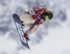 Jamie Anderson of the United States takes a jump on her first run in the women's snowboard slopestyle final at the 2014 Winter Olympics, Sunday, Feb. 9, 2014, in Krasnaya Polyana, Russia.  (AP Photo/Andy Wong)