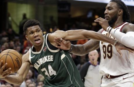 Milwaukee Bucks' Giannis Antetokounmpo (34), from Greece, drives against Cleveland Cavaliers' Jae Crowder (99) in the second half of an NBA basketball game, Tuesday, Nov. 7, 2017, in Cleveland. The Cavaliers won 124-119. (AP Photo/Tony Dejak)