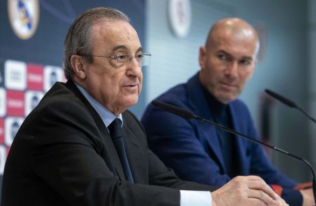 President of Real Madrid Florentino Perez, left, speaks as he is flanked by Zinedine Zidane during a press conference in Madrid, Spain, Thursday, May 31, 2018. Zidane quit as Real Madrid coach on Thursday, less than a week after leading the team to its third straight Champions League title, saying the club needed a change in command. (AP Photo/Borja B. Hojas)