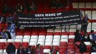 Porto fans hold a banner quoting Portuguese hacker Rui Pinto, on the stands before the Champions League quarterfinal, first leg, soccer match between Liverpool and FC Porto at Anfield Stadium, Liverpool, England, Tuesday April 9, 2019. Pinto has been linked to the publication of internal documents that embarrassed top European clubs and soccer officials in the Football Leaks case. (AP Photo/Dave Thompson)