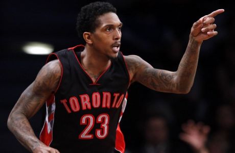 Toronto Raptors' Lou Williams (23) reacts after scoring against the Brooklyn Nets during overtime of an NBA basketball game Friday, Jan. 30, 2015, in New York.Toronto defeated Brooklyn 127-122 in overtime. (AP Photo/Jason DeCrow)
