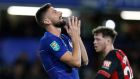 Chelsea's Olivier Giroud reacts after missing a goal opportunity during a League Cup, quarterfinal soccer match between Chelsea and Bournemouth at the Stamford Bridge stadium in London, Wednesday Dec. 19, 2018. (AP Photo/Alastair Grant)