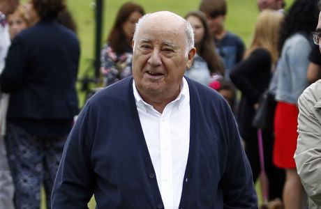 In this July 30, 2016 photo, Amancio Ortega Gaona, founding shareholder of Inditex fashion group, best known for its chain of Zara clothing and accessories retail shops, walks during the Casas Novas International Jumping Show in Arteixo, A Coruña, in the Galicia region of northwest Spain. Amancio Ortega, has been named as the richest person in Europe, and the second richest in the whole world. (AP Photo/Iago Lopez)