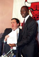 FILE - In this Sept. 21, 1988, file photo, Chicago Bulls' Michael Jordan, right, is all smiles after he signed a new contract with the NBA basketball team as general manager Jerry Krause looks on during a news conference in Chicago, Ill. Krause, the executive behind the Bulls' six NBA titles, has died, the team announced Tuesday, March 21, 2017. He was 77.   (AP Photo/Mark Elias, File)