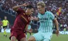 Roma's Chris Smalling, left, challenges for the ball with Atalanta's Rasmus Hojlund during a Serie A soccer match between Roma and Atalanta, at the Olimpic stadium in Rome, Sunday, Sept. 18, 2022. (AP Photo/Andrew Medichini)
