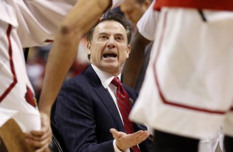 Louisville head coach Rick Pitino talks to his team during timeout in the first half of a second-round game against Michigan in the men's NCAA college basketball tournament Sunday, March 19, 2017, in Indianapolis. (AP Photo/Jeff Roberson)