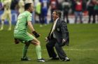 America's coach Miguel Herrera, right, and goalkeeper Agustin Marchesin celebrate after defeating Cruz Azul in the final Mexico soccer league championship match at Azteca stadium in Mexico City, Sunday, Dec. 16, 2018. (AP Photo/Eduardo Verdugo)