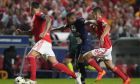 PSG's Kylian Mbappe, center, and Benfica's Antonio Silva vie for the ball during the Champions League group H soccer match between SL Benfica and Paris Saint-Germain at the Luz stadium in Lisbon, Wednesday, Oct. 5, 2022. (AP Photo/Armando Franca)