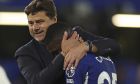 Chelsea's Moises Caicedo is embraced by head coach Mauricio Pochettino after their win in the English Premier League soccer match between Chelsea and Luton Town at Stamford Bridge stadium in London, Saturday, Aug. 26, 2023. (AP Photo/Ian Walton)