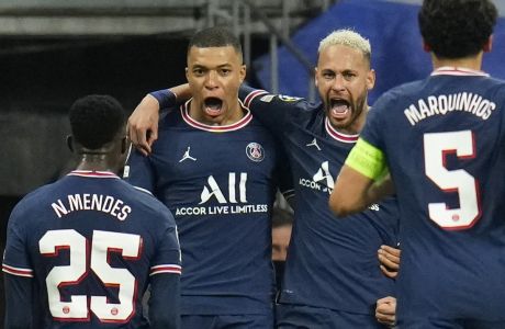 PSG's Kylian Mbappe, center left, celebrates with PSG's Neymar, center right, after Mbappe scored his side's first goal during the Champions League, round of 16, second leg soccer match between Real Madrid and Paris Saint-Germain at the Santiago Bernabeu stadium in Madrid, Spain, Wednesday, March 9, 2022. (AP Photo/Manu Fernandez)