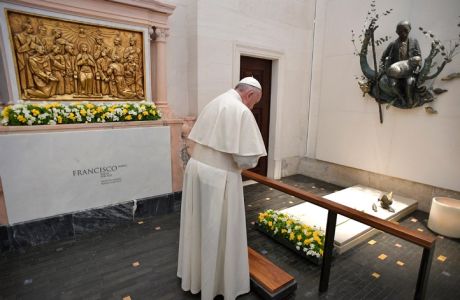 Pope Francis prays at the grave site of Jacinta and Francisco Marto at the Sanctuary of Our Lady of Fatima, Saturday, Friday, May 13, 2017, in Fatima, Portugal. Pope Francis urged Catholics on Friday to "tear down all walls" and spread peace as he traveled to this Portuguese shrine town to canonize two poor, illiterate shepherd children whose visions of the Virgin Mary 100 years ago marked one of the most important events of the 20th-century Catholic Church. (L'Osservatore Romano/Pool Photo via AP)