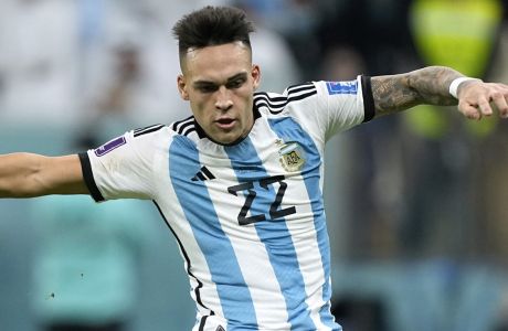Argentina's Lautaro Martinez in action during the World Cup quarterfinal soccer match between the Netherlands and Argentina, at the Lusail Stadium in Lusail, Qatar, Saturday, Dec. 10, 2022. (AP Photo/Jorge Saenz)