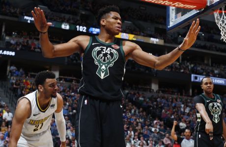 Milwaukee Bucks forward Giannis Antetokounmpo reacts after being called for a foul on Denver Nuggets guard Jamal Murray during the second half of an NBA basketball game Sunday, April 1, 2018, in Denver. The Nuggets won 128-125 in overtime. (AP Photo/David Zalubowski)