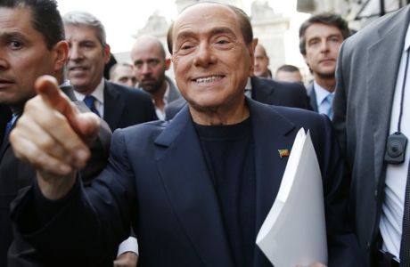 Italian former Premier Silvio Berlusconi arrives to join a demonstration to ask more security along the streets, in Milan, Italy, Saturday, March 11, 2017. (AP Photo/Antonio Calanni)