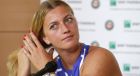 Petra Kvitova of the Czech Republic adjusts her hair during a press conference at the Roland Garros stadium, Friday, May 26, 2017 in Paris. Kvitova has confirmed she is making her comeback at the French Open, less than six months after being attacked by a knife-wielding intruder. Kvitova has missed all season so far while recovering from surgery on her left, racket-holding hand in December. (AP Photo/Christophe Ena)