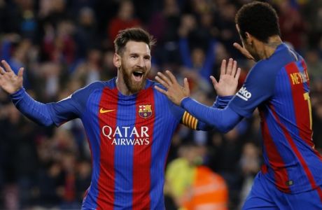 Barcelona's Lionel Messi, left, celebrates with teammate Neymar after scoring the opening goal against Celta during a Spanish La Liga soccer match between Barcelona and Celta at the Camp Nou stadium in Barcelona, Saturday, March 4, 2017. (AP Photo/Francisco Seco)