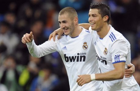 Real Madrid's Karim Benzema (L) celebrates his goal with teammate Cristiano Ronaldo during their Spanish King's Cup soccer match at Santiago Bernabeu stadium in Madrid December 22, 2010. REUTERS/ Felix Ordonez(SPAIN - Tags: SPORT SOCCER)
