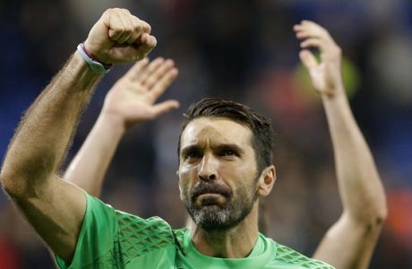 Juventus goalkeeper Gianluigi Buffon clenches his fist after the Champions League Group H soccer match against Lyon, Tuesday Oct. 18, 2016, in Lyon, central France. Juventus won 1-0. (AP Photo/Laurent Cipriani)